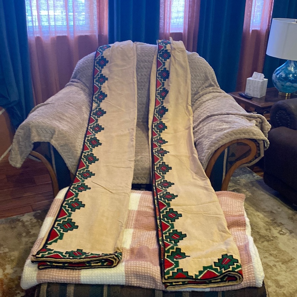 Beautiful embroidered drapes, tan with black, green and red geometric embroidery